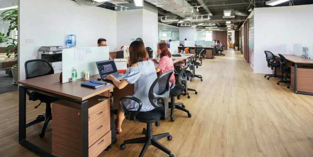 Spacious modern office in Vietnam with employees collaborating at desks.