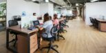 Spacious modern office in Vietnam with employees collaborating at desks.